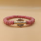 CAMÉLÉON.             Bracelet rose.                Perle akan couleur or