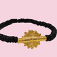 CAMÉLÉON.             Bracelet noir.                Perle akan couleur or