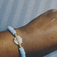 CAMÉLÉON.            Bracelet bleu pastel-    Perle akan couleur or
